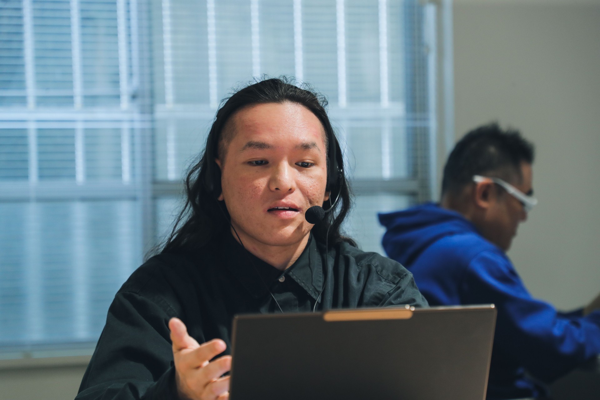 Diverse customer service agent helping to support his customers